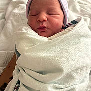Serenity is registered to the contest to win money with this photo: newborn, baby, infant, sleeping, wrapped, blanket, hat, hospital, soft, cute, peaceful, child, portrait, face, skin, resting, indoors, person, head, newborn_baby