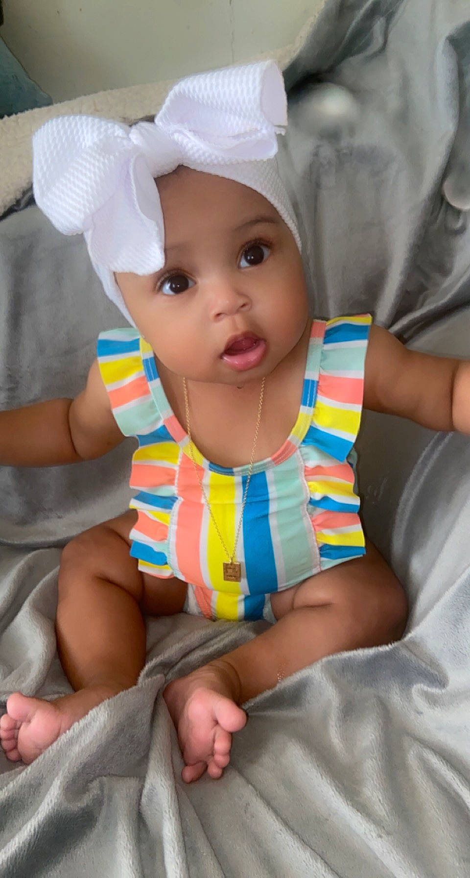 Alani joined the competition — help win amazing prizes! arm, baby, baby_products, baby_toddler_clothing, cap, cheek, child, comfort, finger, fun, happy, headgear, headwear, leg, mouth, person, pink, skin, sleeve, surprise