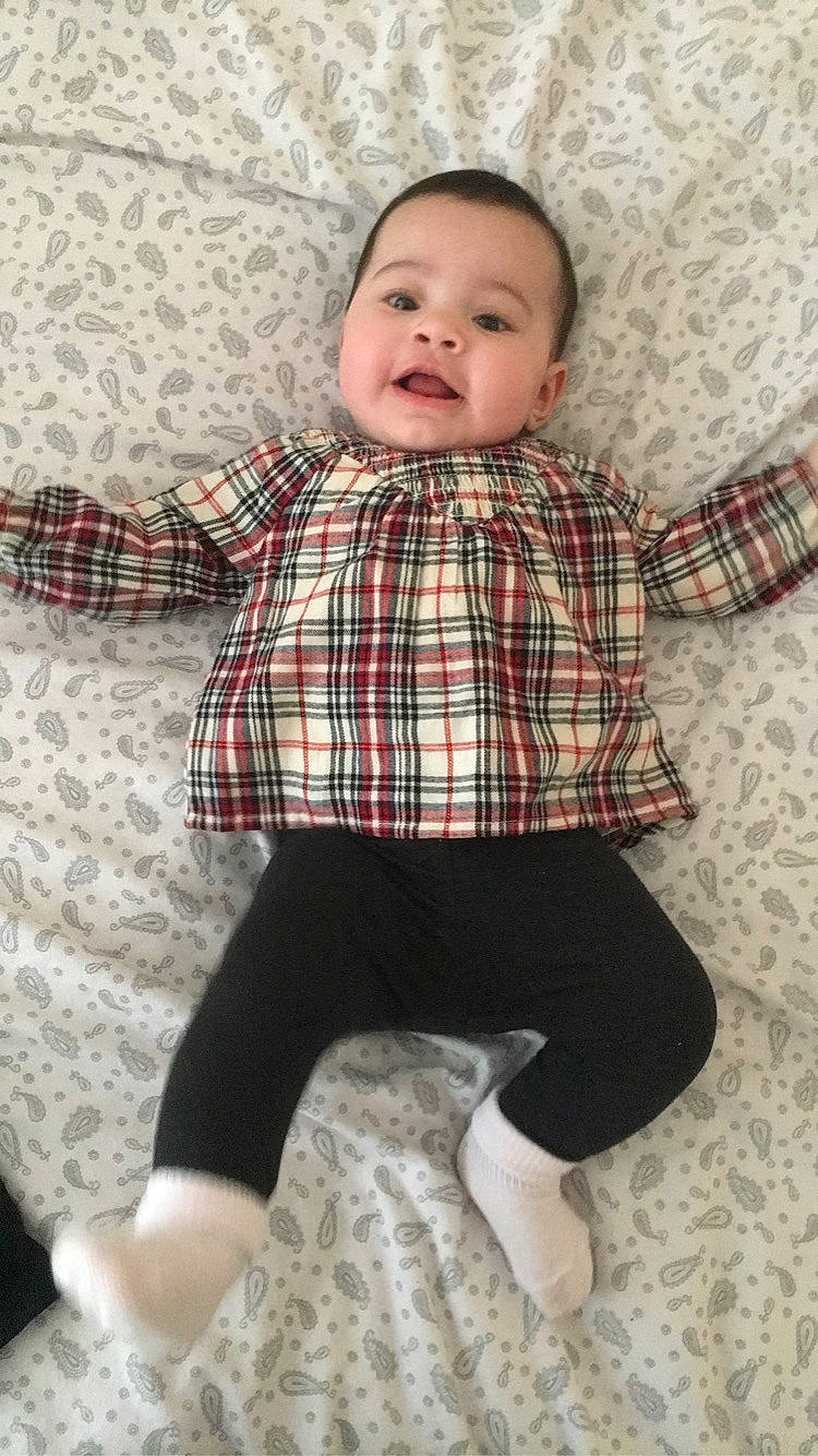 Rosie-lee joined the competition — help win amazing prizes! baby, baby_toddler_clothing, child, design, pattern, person, plaid, product, sitting, skin, sleeve, smile, tartan, textile, toddler
