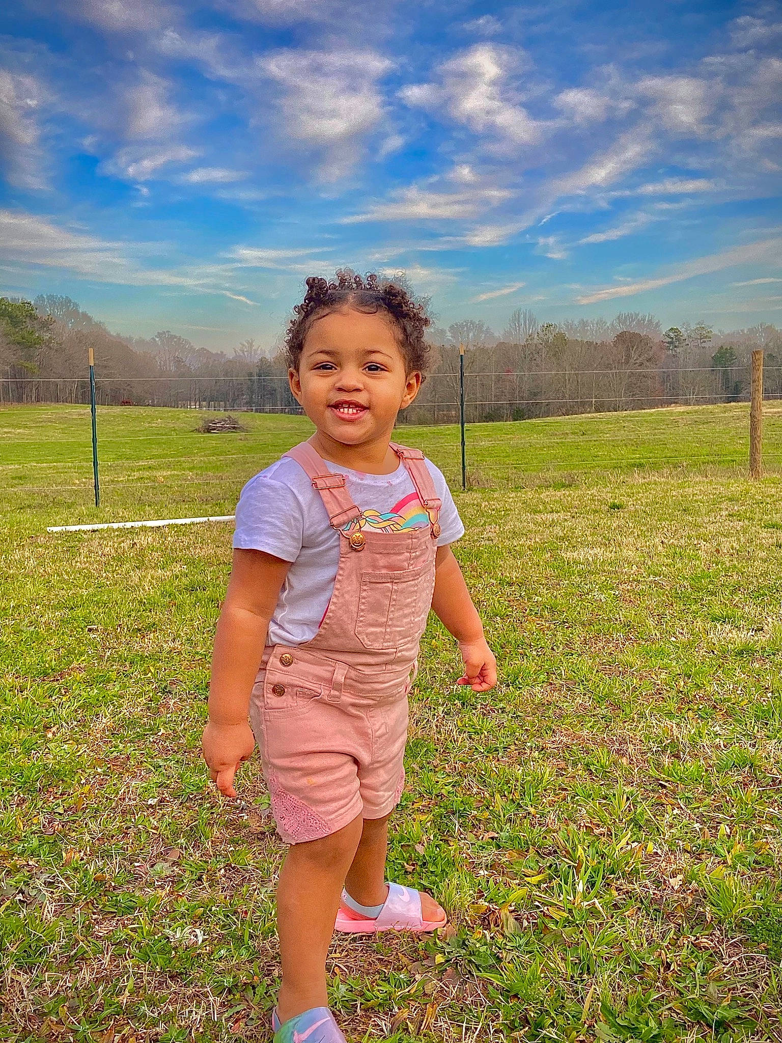 Braylee is registered to the contest to win money with this photo: agriculture, cloud, flower, fun, grass, grass_family, grassland, happy, joy, landscape, leisure, meadow, natural_landscape, people_in_nature, person, plain, plant, prairie, sky, sunlight