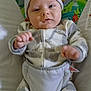 baby, infant, child, onesie, hat, baby_seat, animal_print, elephant, giraffe, toucan, sloth, pacifier, cute, face, indoor, comfort, clothing, young_child, person, smiling
