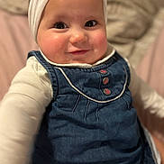 Camille participe au concours pour gagner de l'argent avec cette photo : baby, infant, child, smile, portrait, headwrap, denim_dress, onesie, cheeks, eyes, cute, indoors, bed, blurred_background, closeup, happy, young, fashion, drool, playful