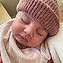 baby, sleeping, hat, knit_hat, bib, closeup, face, child, infant, soft_texture, cozy, pink, skin, eyelashes, peaceful, cute, warm, portrait, indoors, resting