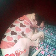 Diamond is registered to the contest to win money with this photo: baby, black_hair, carmine, child, comfort, flesh, flooring, fun, hand, head, human_leg, linens, magenta, mouth, nail, pattern, pink, textile, thigh, toddler