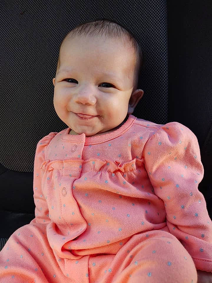 Marley is registered to the contest to win money with this photo: baby, cheek, child, chin, face, head, joy, lip, peach, person, pink, skin, smile, toddler