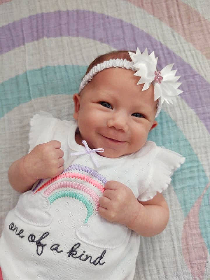 Marley is registered to the contest to win money with this photo: baby, baby_products, baby_toddler_clothing, cheek, child, face, fashion_accessory, forehead, hair_accessory, happy, head, headband, headgear, headpiece, headwear, joy, person, pink, product, skin