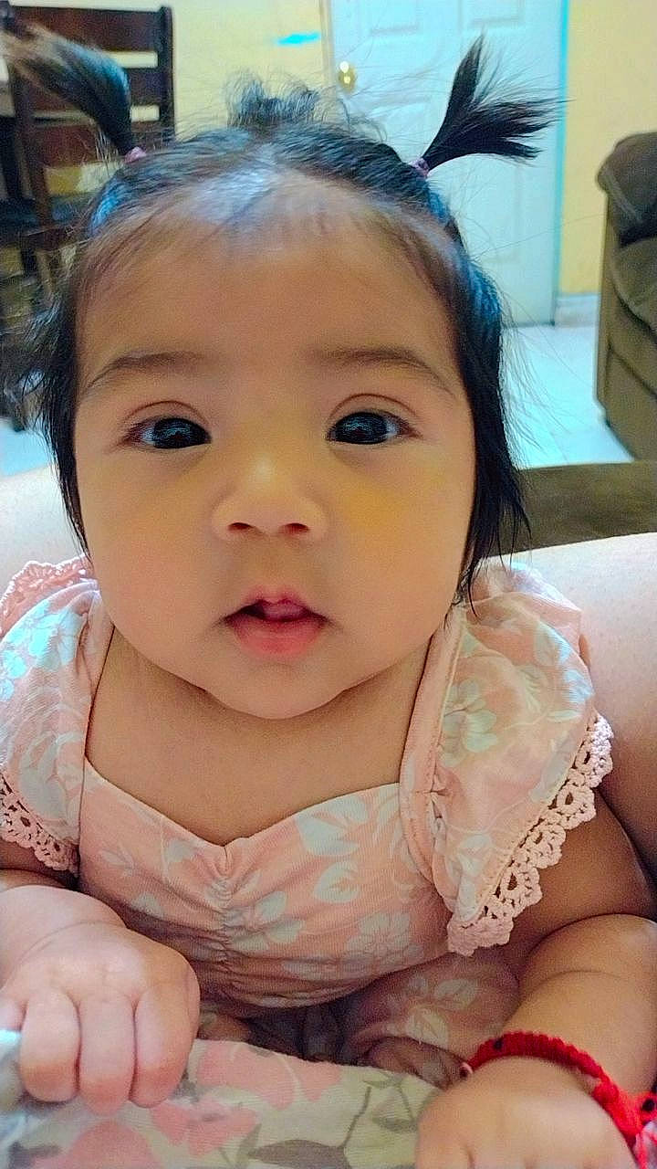 Aliyah is registered to the contest to win money with this photo: baby, baby_toddler_clothing, cheek, chin, ear, eye, eyebrow, eyelash, facial_expression, finger, gesture, hairstyle, happy, head, iris, lip, mouth, neck, nose, person