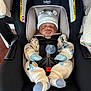 Jasiah is registered to the contest to win money with this photo: baby, infant, car_seat, britax, sleeping, onesie, hat, mittens, pacifier, straps, child, cute, indoors, seatbelt, comfort, safety, portrait, newborn, cozy, resting
