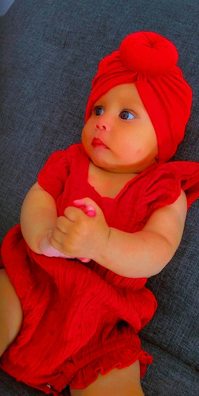 Maliah participe au concours pour gagner de l'argent avec cette photo : baby, baby_toddler_clothing, cap, cheek, face, fur, happy, hat, headgear, headwear, lip, magenta, nose, orange, outerwear, peach, person, pink, skin, sleeve