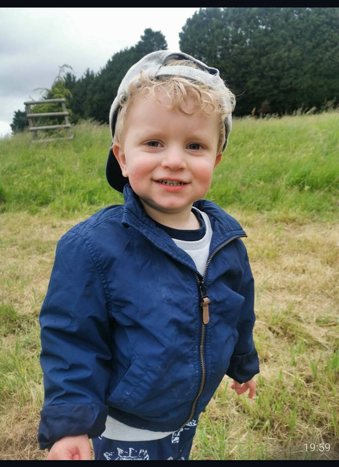 Rex joined the competition — help win amazing prizes! baby, cheek, child, face, facial_expression, grass, happy, head, jacket, joy, outerwear, person, photography, portrait, skin, smile, toddler