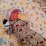baby, newborn, crib, bottle, feeding, pajamas, hat, sleepwear, infant, cute, snoopy, stars, moon, sun, clouds, blanket, sleep, child, indoors, resting
