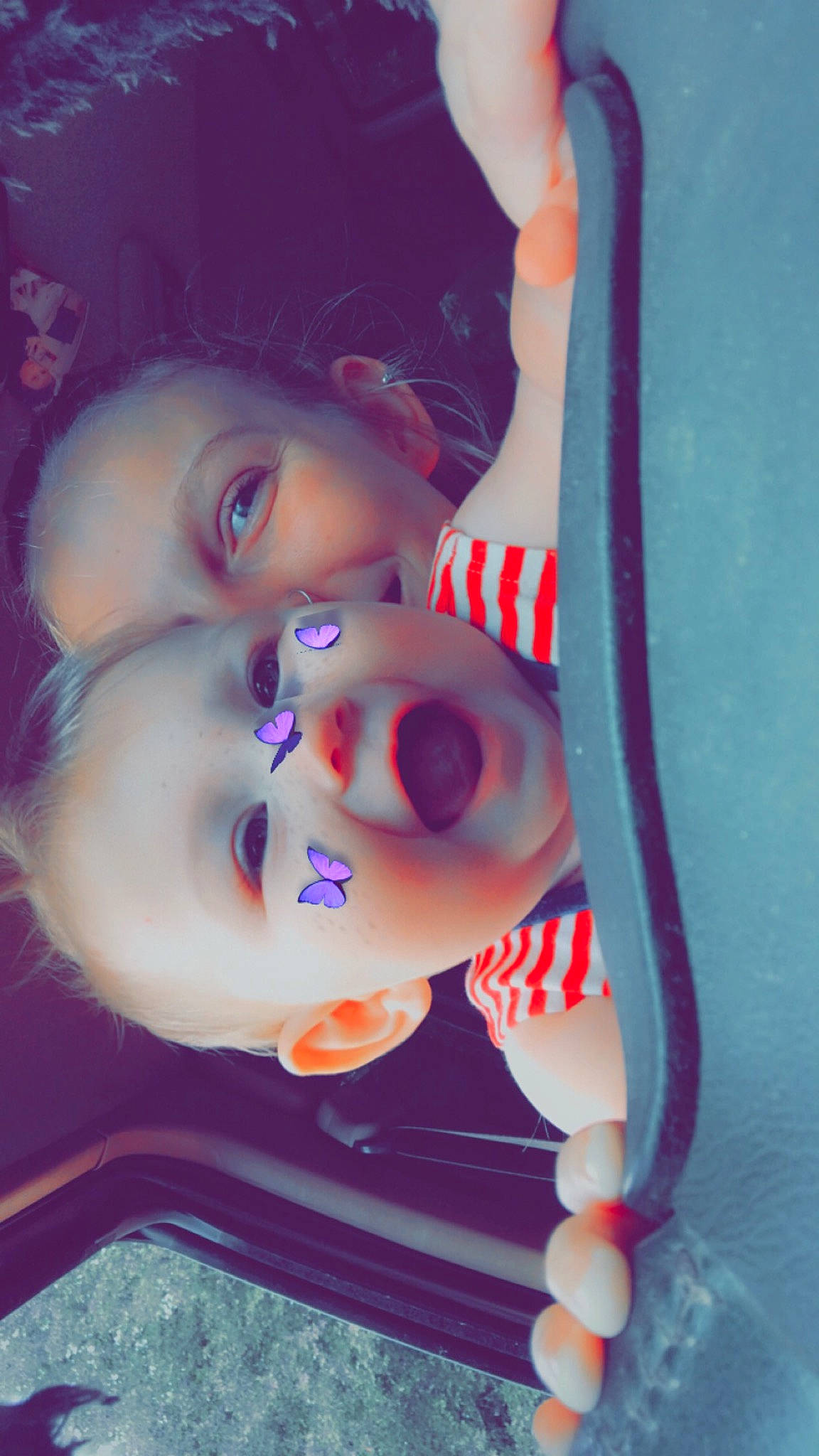 Chaya is registered to the contest to win money with this photo: arm, doll, dress, eye, eyebrow, eyelash, finger, gesture, glasses, hand, head, human_body, jaw, lip, mouth, nose, orange, person, skin, sunglasses