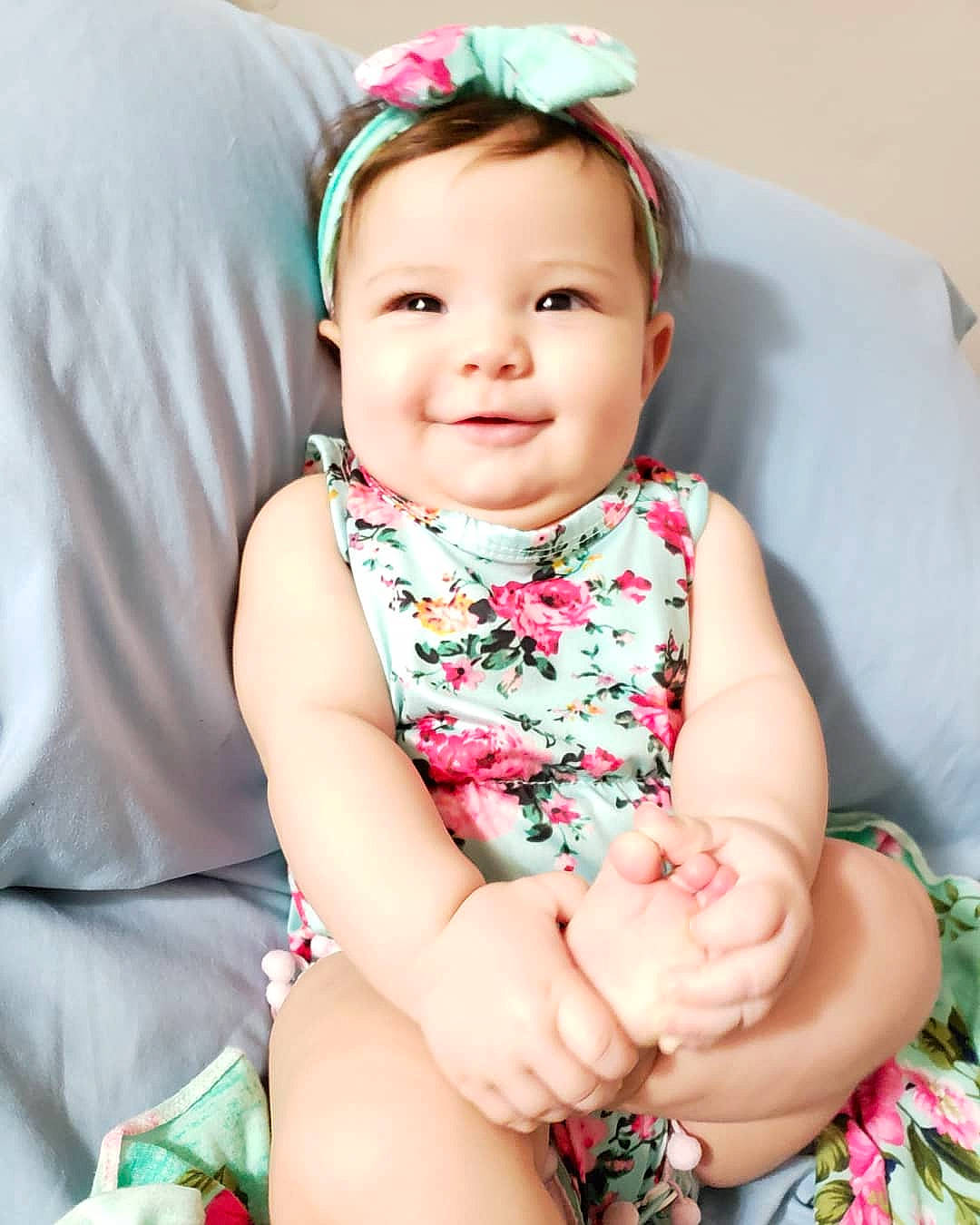 Lizzie joined the competition — help win amazing prizes! baby, baby_products, baby_toddler_clothing, beauty, cheek, child, child_model, dress, fashion_accessory, hair_accessory, headgear, joy, pattern, person, photography, pink, plant, product, sitting, skin