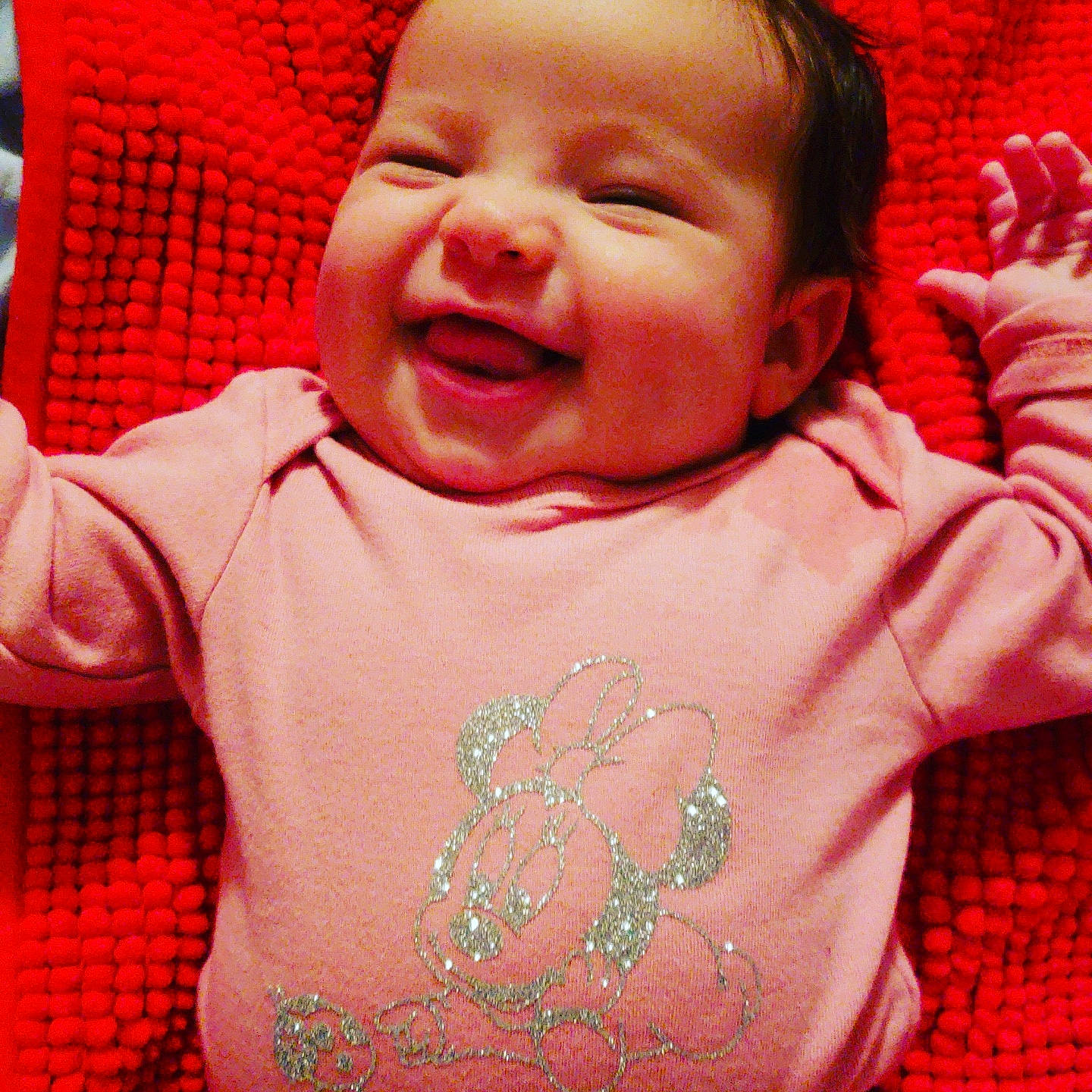 Lizzie is registered to the contest to win money with this photo: baby, cheek, child, cool, face, facial_expression, forehead, fun, happy, head, laugh, lip, mouth, nose, person, pink, red, skin, smile, textile