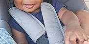 Zayonn a rejoint le concours — aidez-le/la à gagner de superbes lots ! baby, car_seat, casual, child, closeup, clothing, cute, denim, face, hands, happy, indoors, infant, person, portrait, seatbelt, secure, sitting, smiling, young_child