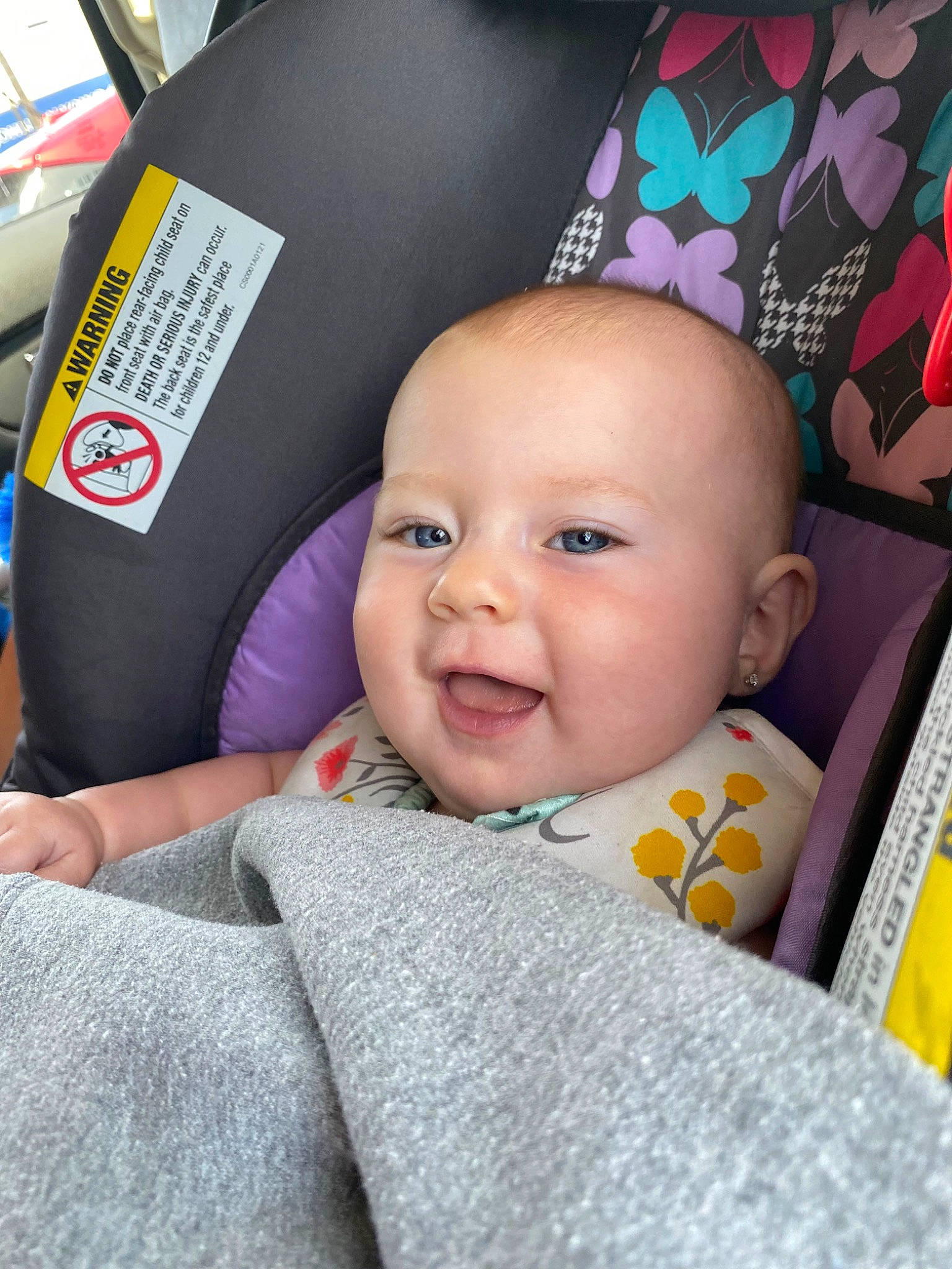 Dixie is registered to the contest to win money with this photo: baby, baby_carriage, baby_products, baby_toddler_clothing, car_seat, cheek, child, comfort, happy, linens, magenta, motor_vehicle, nose, person, pink, purple, skin, smile, textile, toddler