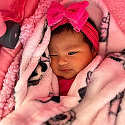 Jaslyn Cloe is registered to the contest to win money with this photo: baby, newborn, infant, headband, bow, blanket, pink, wrapped, cozy, drowsy, car_seat, portrait, face, cheeks, soft_texture, close_up, cute, nursery, fleece_blanket, warmth