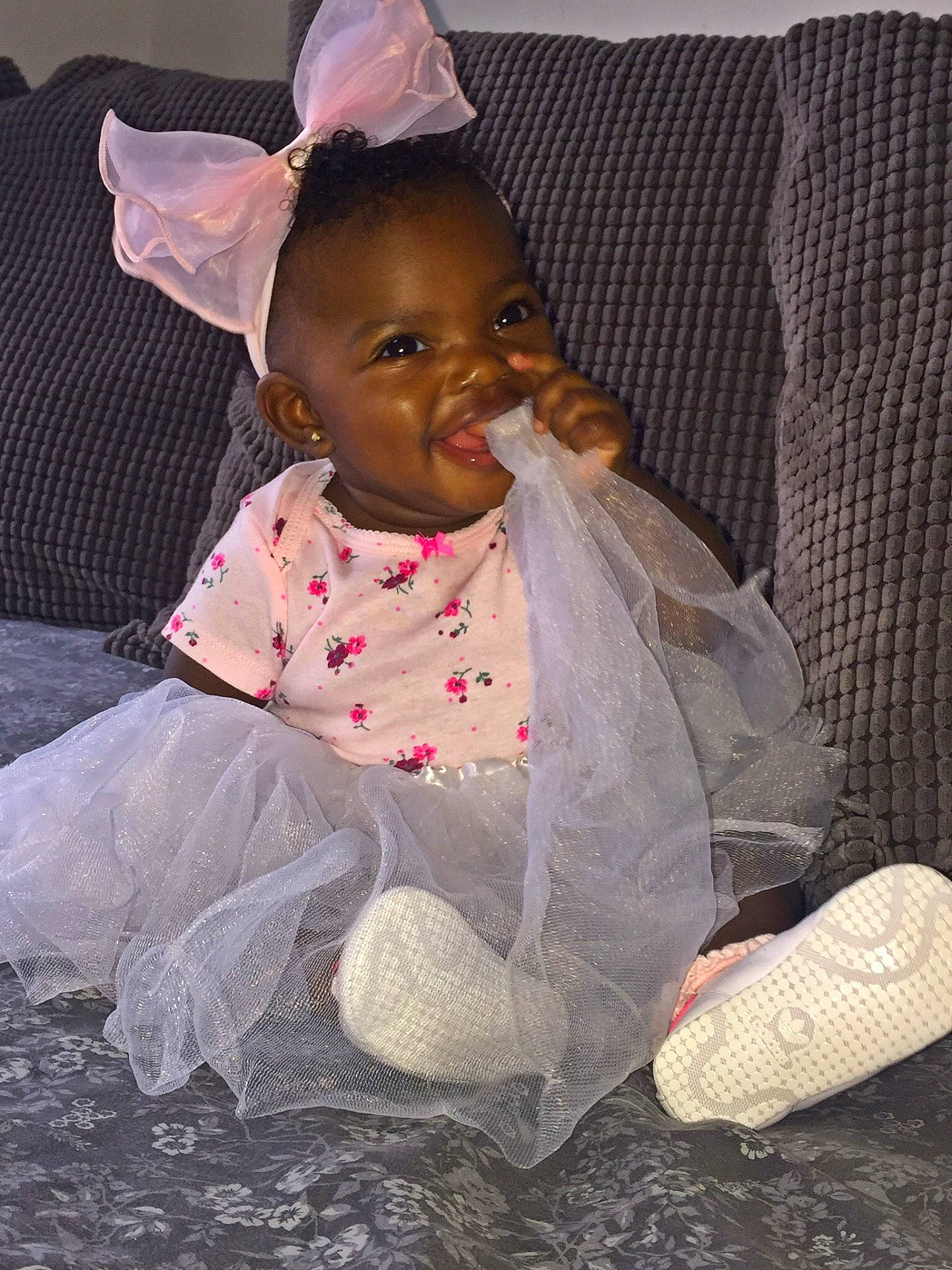 Lovie is registered to the contest to win money with this photo: child, eye, fun, girl, hair_accessory, headgear, human, infant, joy, person, pink, product, skin, smile, textile, toddler