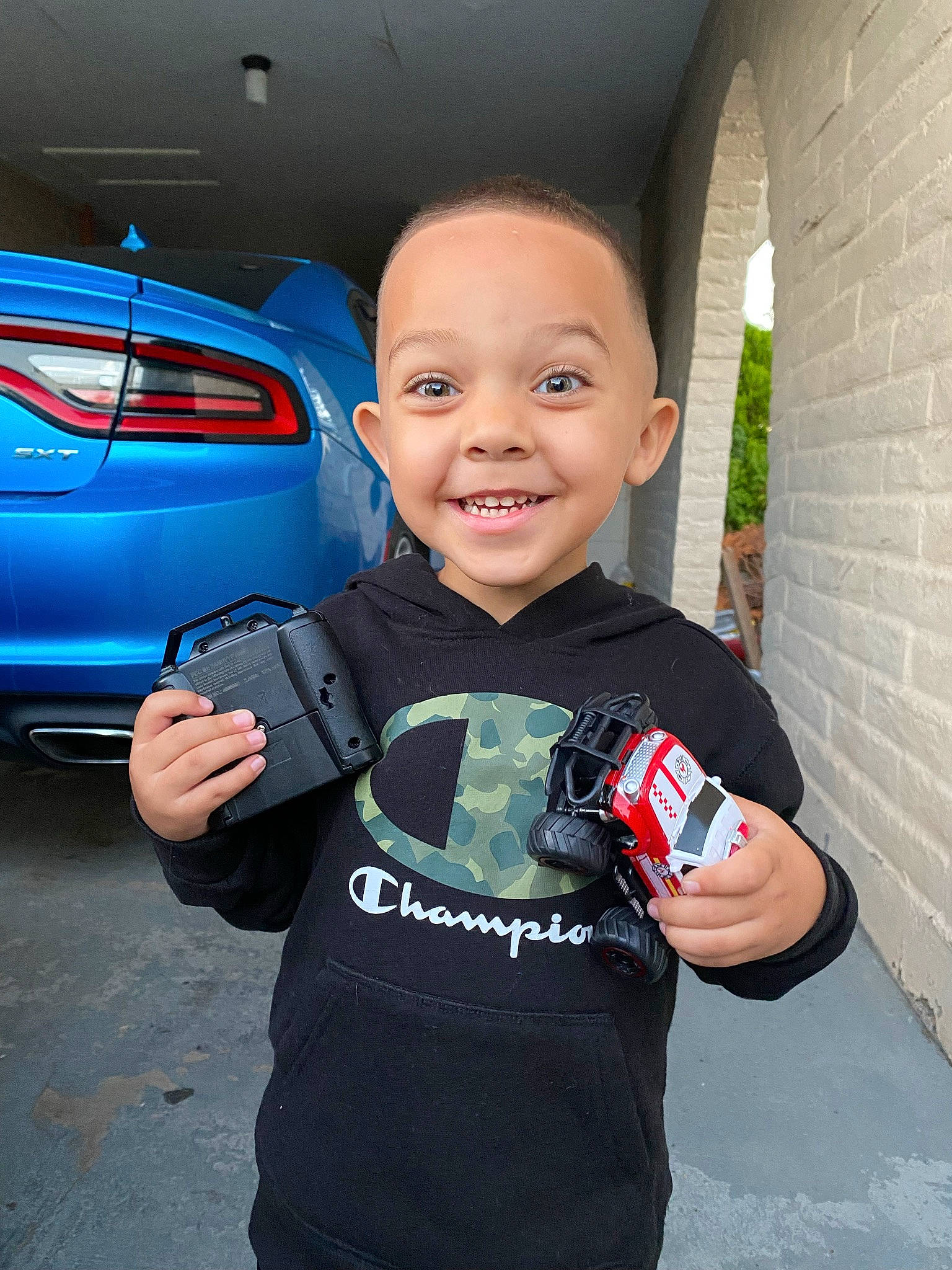 Anakin joined the competition — help win amazing prizes! automotive_design, automotive_exterior, automotive_lighting, automotive_tire, bumper, car, electric_blue, gesture, happy, hood, joy, motor_vehicle, person, personal_luxury_car, rim, smile, t_shirt, thumb, toddler, trunk