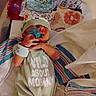 Wyatt is registered to the contest to win money with this photo: newborn, baby, infant, hospital, pacifier, blanket, clothing, onesie, bracelet, medical, bassinet, cute, sleeping, baby_hat, child, person, hospital_bed, toddler, soft_toys, colorful