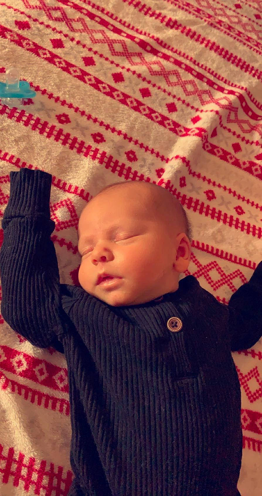 Valen joined the competition — help win amazing prizes! baby, baby_toddler_clothing, cheek, child, comfort, flooring, headgear, knit_cap, linens, magenta, pattern, person, pink, red, skin, sleeve, textile, toddler, wood, wool