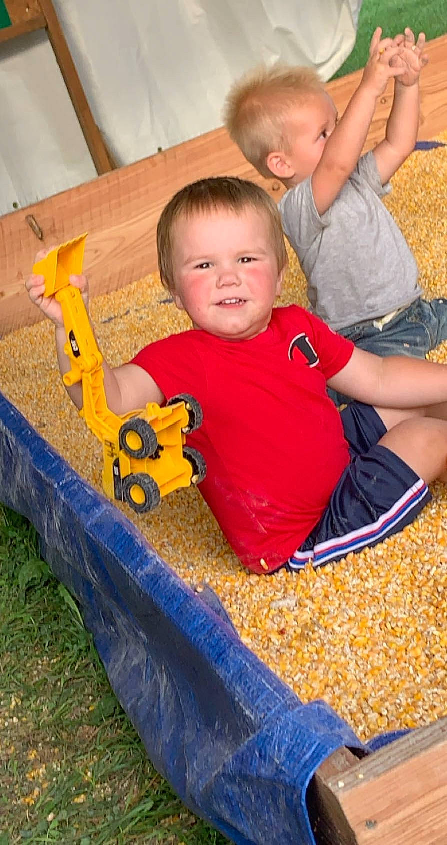 Vincent joined the competition — help win amazing prizes! arm, baby, baby_toddler_clothing, child, eye, face, fun, grass, happy, head, lap, leisure, orange, person, sitting, sleeve, smile, t_shirt, toddler, toy