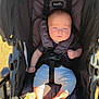baby, stroller, blanket, sunlight, infant, child, seatbelt, clothing, foot, hand, outdoor, person, portrait, comfort, resting, soft, casual, infantwear, babygear, relaxed