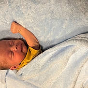 Westin joined the competition — help win amazing prizes! baby, newborn, sleeping, blanket, blue_blanket, infant, peaceful, arm_raised, soft_texture, cozy, indoors, cute, resting, child, wrapped, portrait, head, skin, clothing, peace
