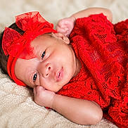 Iyla is registered to the contest to win money with this photo: baby, infant, red_lace, headband, newborn, lying_down, blanket, soft_texture, cute, portrait, child, sleepwear, resting, closeup, adorable, peaceful, hand, face, skin, indoors