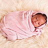 Iyla is registered to the contest to win money with this photo: newborn, baby, pink_blanket, swaddled, infant, soft_texture, fluffy_surface, portrait, sleepy, cute, wrapped, resting, child, cozy, warm, head, face, skin, lying_down, peaceful