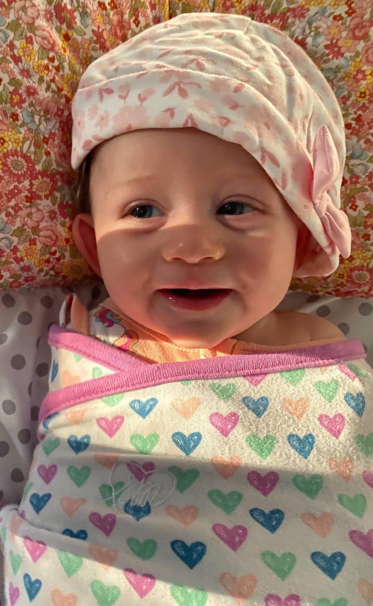 Lakyn is registered to the contest to win money with this photo: baby, baby_laughing, baby_toddler_clothing, cap, cheek, child, face, happy, headgear, headwear, human_body, iris, lip, nose, person, pink, product, skin, smile, textile