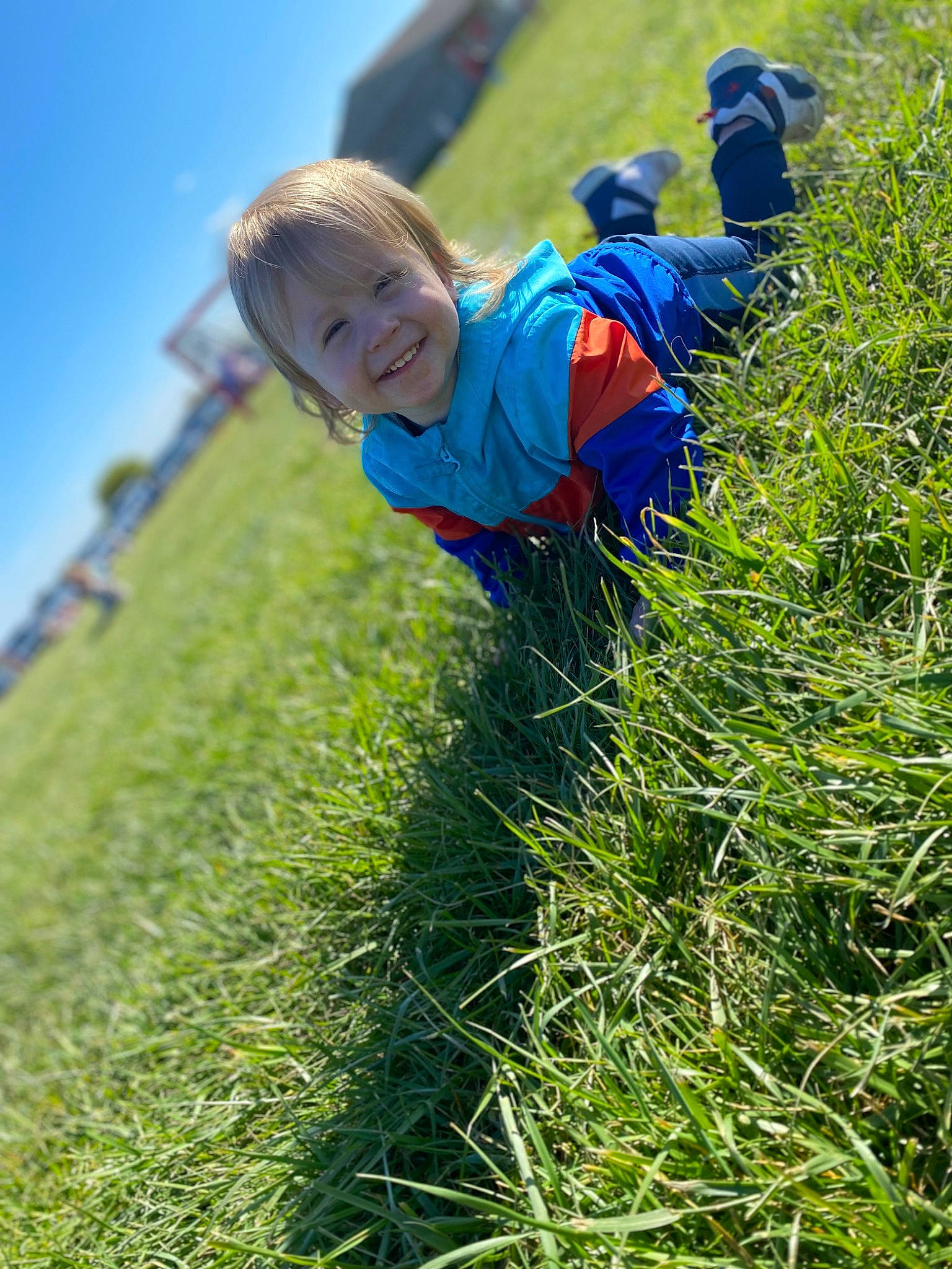 Mason is registered to the contest to win money with this photo: agriculture, electric_blue, fun, grass, grass_family, grassland, groundcover, happy, joy, landscape, leisure, meadow, natural_landscape, pasture, people_in_nature, person, plant, prairie, shrub, sky