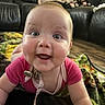 baby, smiling, crawling, blanket, living_room, happy, child, face, cute, indoors, person, infant, clothing, expression, floor, skin, head, eyes, mouth, joy