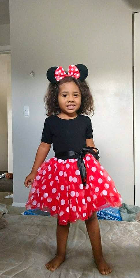 Rayne is registered to the contest to win money with this photo: abdomen, child, day_dress, event, fashion_accessory, fashion_design, fun, happy, hat, human_leg, joy, knee, magenta, pattern, person, pink, shoulder, sleeve, thigh, toddler