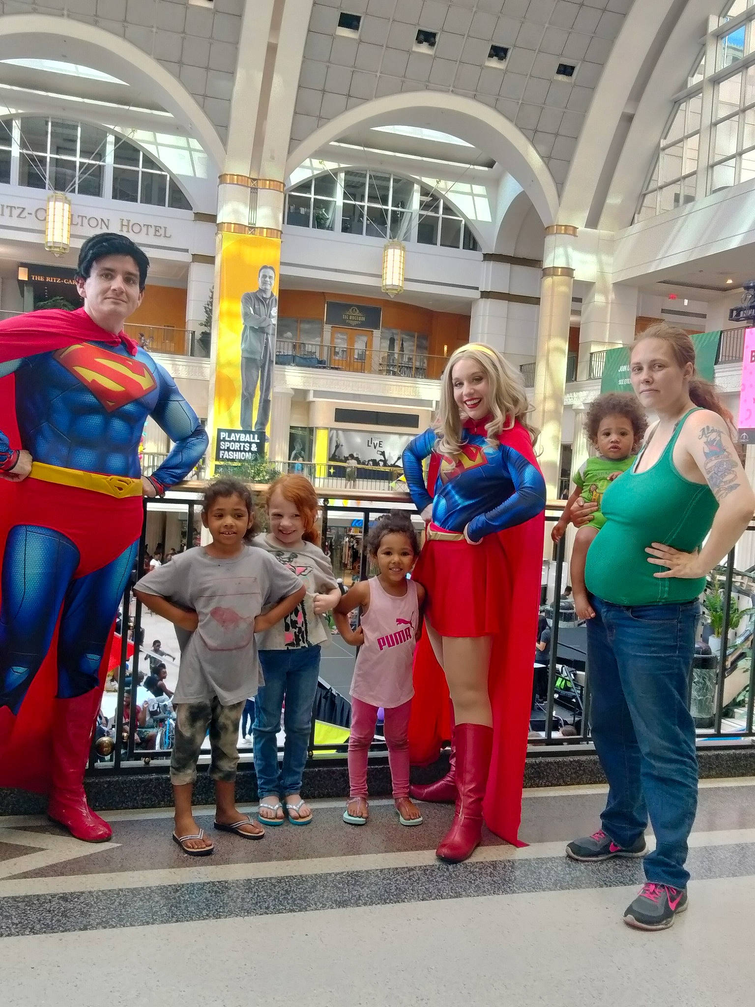 Alaya is registered to the contest to win money with this photo: boot, building, child, city, costume, event, fictional_character, footwear, fun, joy, justice_league, leisure, luggage_and_bags, pedestrian, people, person, recreation, shoe, superhero, superman