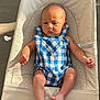 Léo a rejoint le concours — aidez-le/la à gagner de superbes lots ! baby, infant, blue_checkered_clothing, romper, baby_seat, cushion, beige, sunlight, indoor, floor, skin, foot, hand, head, face, expression, child, newborn, comfort, relaxing