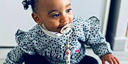 Siyanna a rejoint le concours — aidez-le/la à gagner de superbes lots ! toddler, child, pacifier, hair_ties, sweater, pants, barefoot, floor, indoor, sitting, cute, baby, person, young_child, portrait, curious, skin, hair, clothing, feet