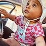 baby, car, car_door, checkered_pattern, child, clothing, cute, eyes, face, hand, hat, infant, outdoor, person, portrait, red_shirt, seat, sunhat, window, young