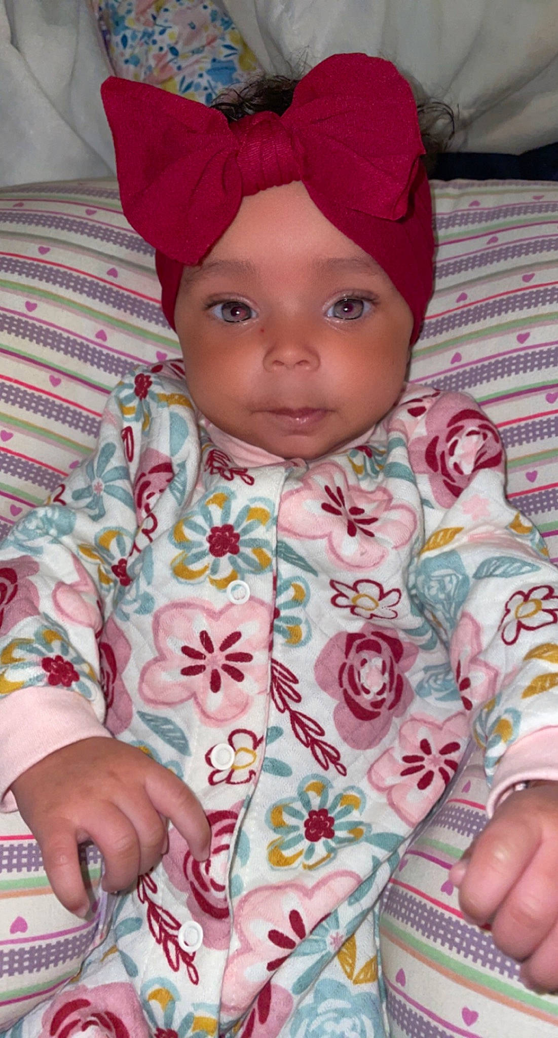 Khalia joined the competition — help win amazing prizes! baby, baby_toddler_clothing, cap, cheek, child, face, facial_expression, headwear, human, lip, mouth, nose, organ, outerwear, person, pink, product, skin, sleeve, smile