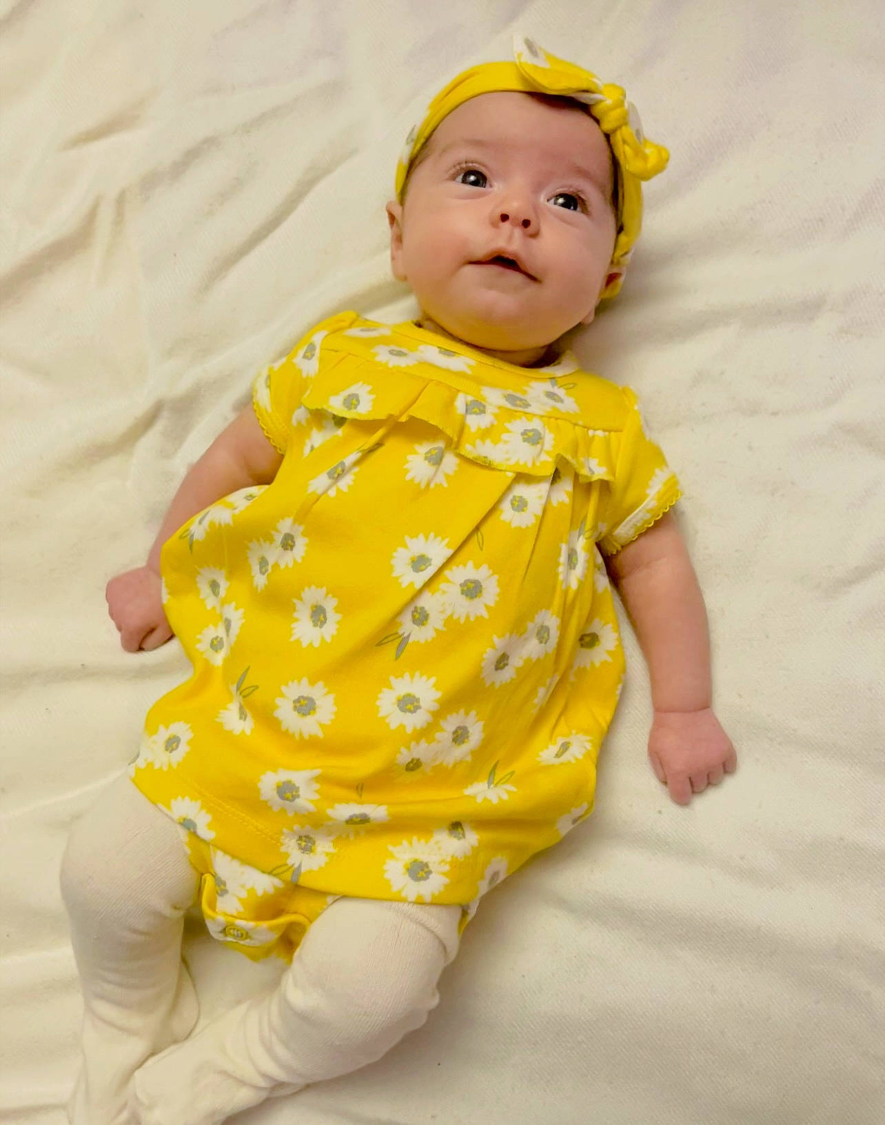 Caroline joined the competition — help win amazing prizes! arm, baby, baby_products, baby_toddler_clothing, child, collar, comfort, face, fun, happy, human_leg, infant_bodysuit, linens, one_piece_garment, pattern, peach, person, sitting, sleeve, toddler