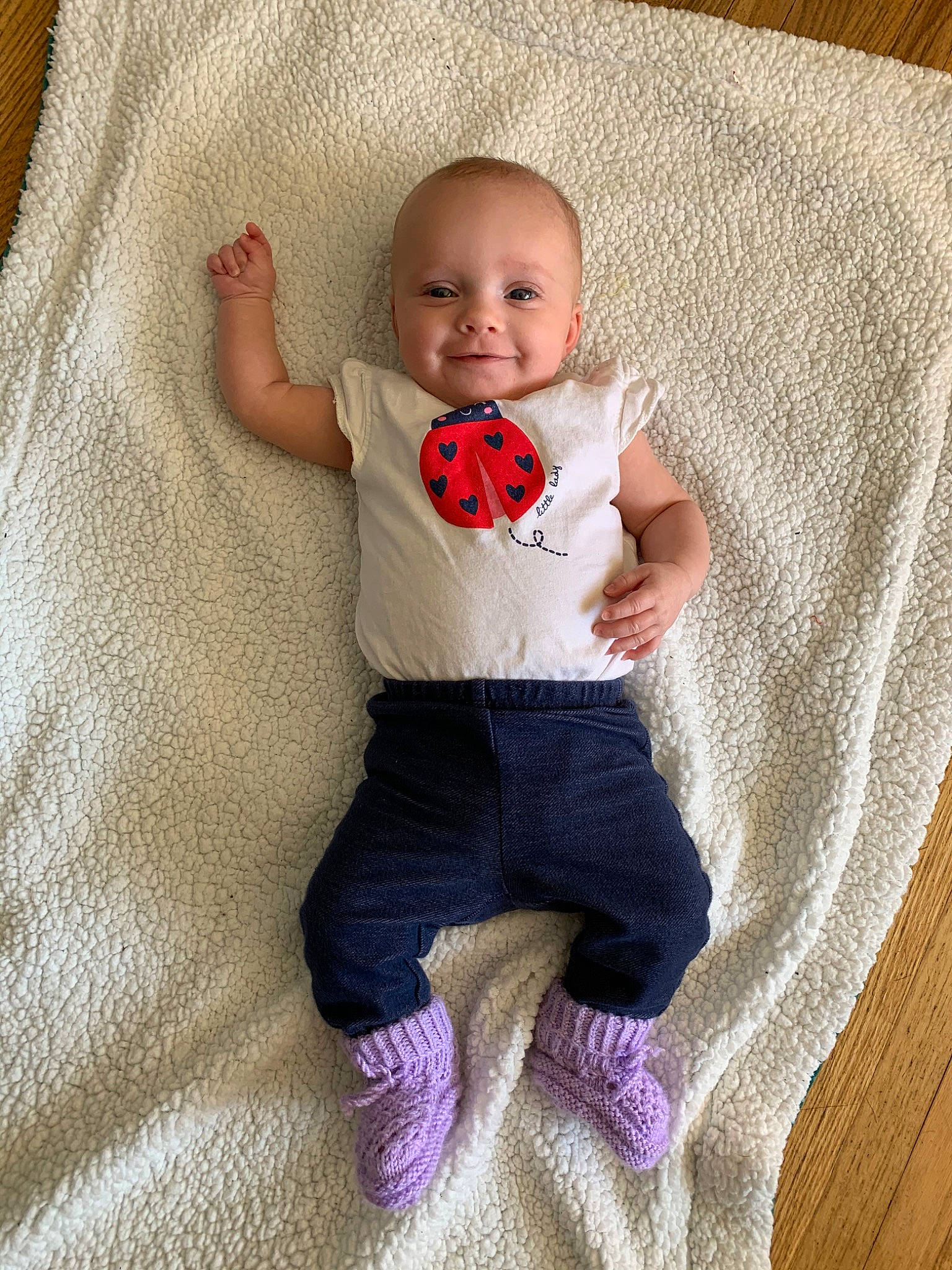 Emmalee is registered to the contest to win money with this photo: baby, baby_products, baby_toddler_clothing, cheek, child, face, finger, head, joy, leg, linens, people, person, pink, product, sitting, skin, sleeve, smile, t_shirt