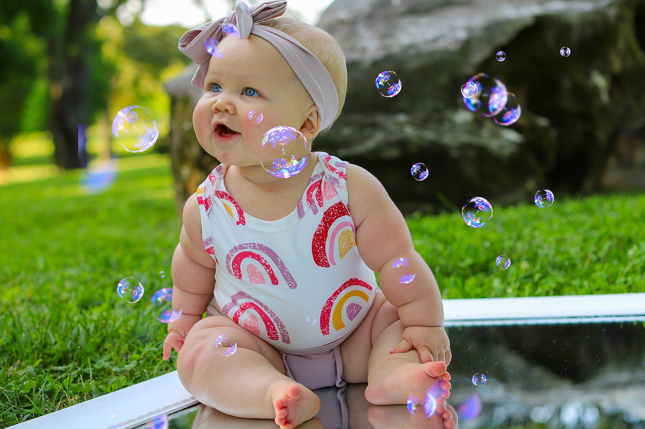 Memphis is registered to the contest to win money with this photo: baby, baby_toddler_clothing, child, fun, grass, happy, headwear, human_leg, leisure, people, people_in_nature, person, pink, plant, recreation, sitting, skin, spring, summer, sunlight