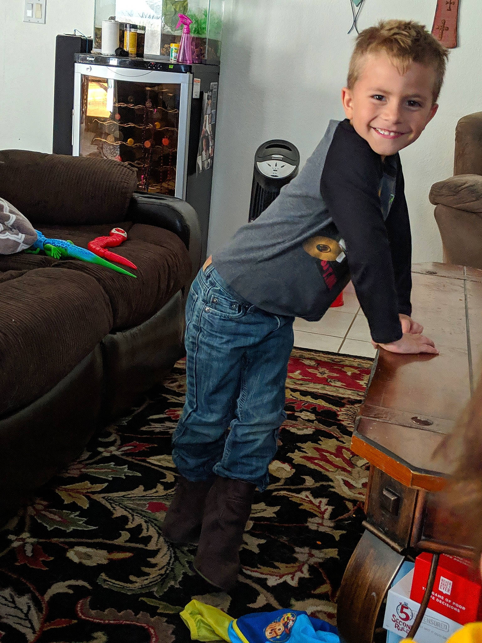 Zander is registered to the contest to win money with this photo: child, floor, flooring, furniture, jeans, joy, male, person, play, room, sitting, toddler