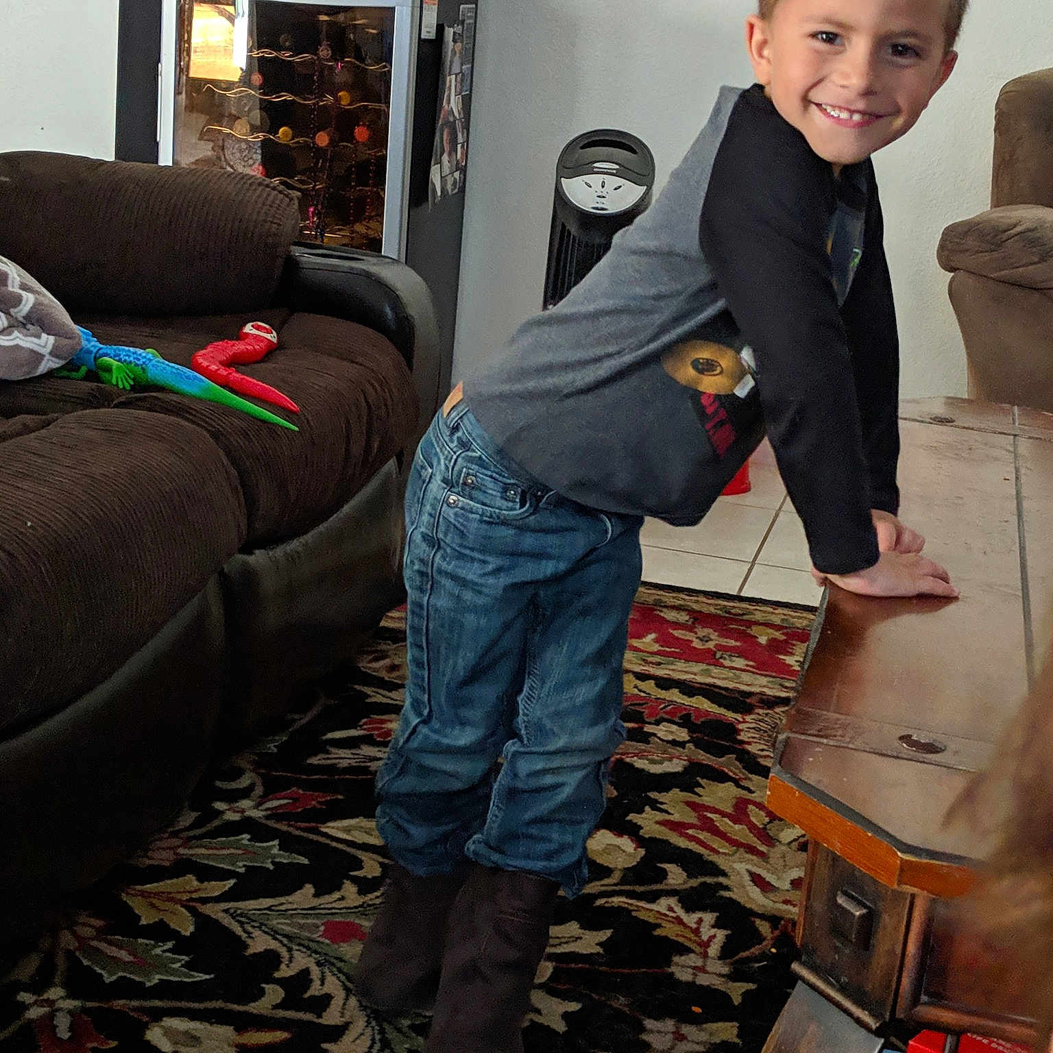 Zander is registered to the contest to win money with this photo: child, floor, flooring, furniture, jeans, joy, male, person, play, room, sitting, toddler