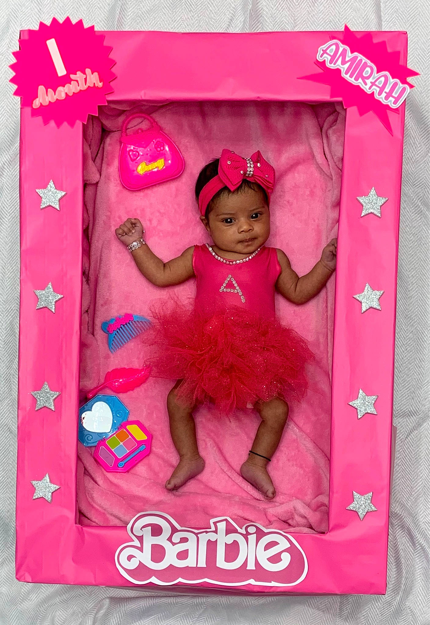 Amirah joined the competition — help win amazing prizes! baby_toddler_clothing, embellishment, font, happy, headwear, linens, magenta, paper_product, pattern, peach, person, pink, rectangle, sleeve