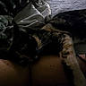 Kira joined the competition — help win amazing prizes! cat, calico_cat, sleeping, lying_down, pet, feline, fur, whiskers, paws, animal, lap, person, legs, blanket, bed, cozy, indoors, dim_lighting, relaxed, photograph