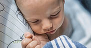 Elijah joined the competition — help win amazing prizes! baby, bed, blanket, child, close_up, closed_eyes, cozy, face, hand, indoors, infant, nap, peaceful, pillow, portrait, resting, sleeping, soft_lighting, striped_blanket, 寝室