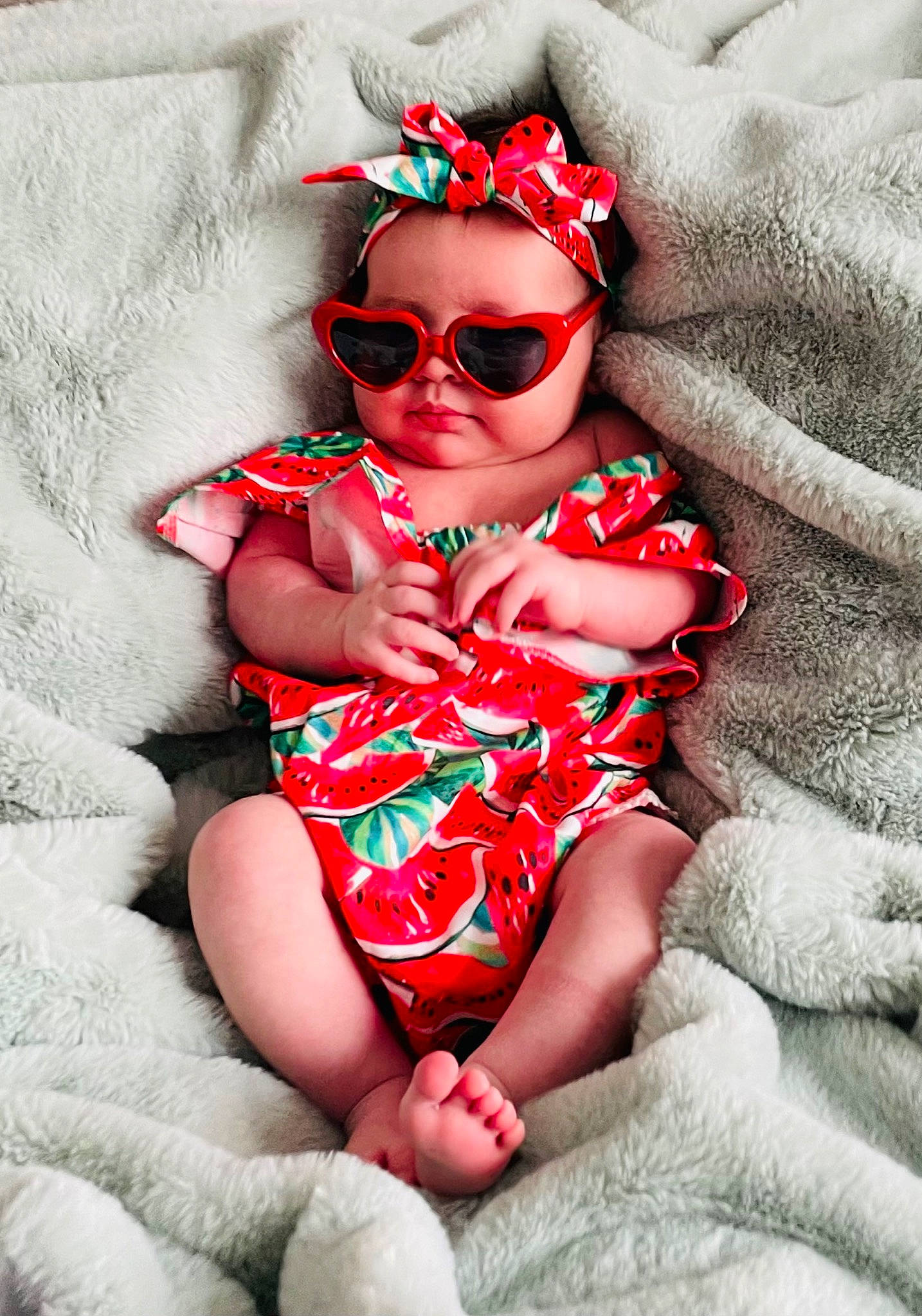 Indie is registered to the contest to win money with this photo: arm, baby_toddler_clothing, comfort, eye, eyewear, face, flash_photography, glasses, goggles, happy, head, human_body, leg, lip, person, skin, sleeve, sunglasses, textile, thigh
