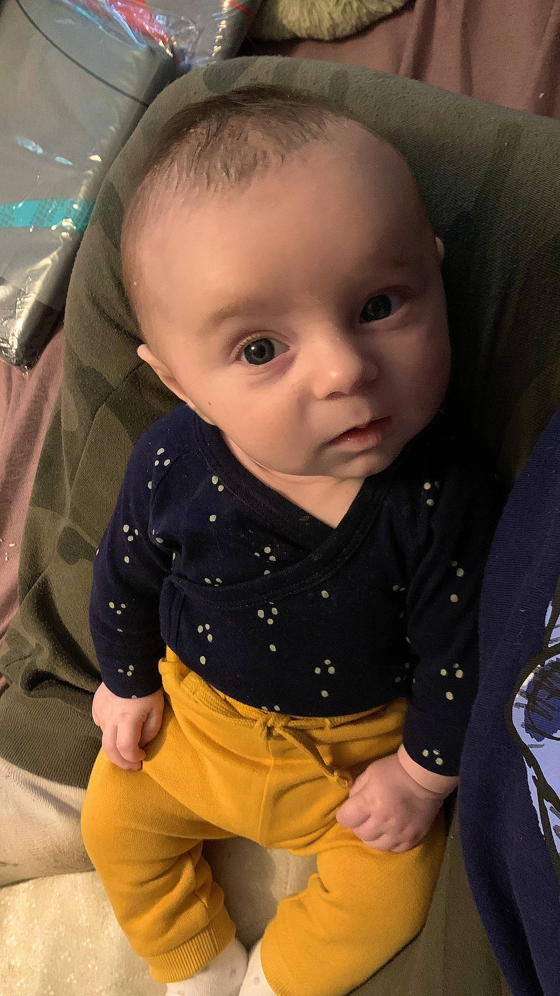 Milo participe au concours pour gagner de l'argent avec cette photo : baby, baby_toddler_clothing, cheek, face, facial_expression, finger, human, human_body, iris, khaki_pants, mammal, mouth, neck, nose, person, product, skin, sleeve, standing, toddler