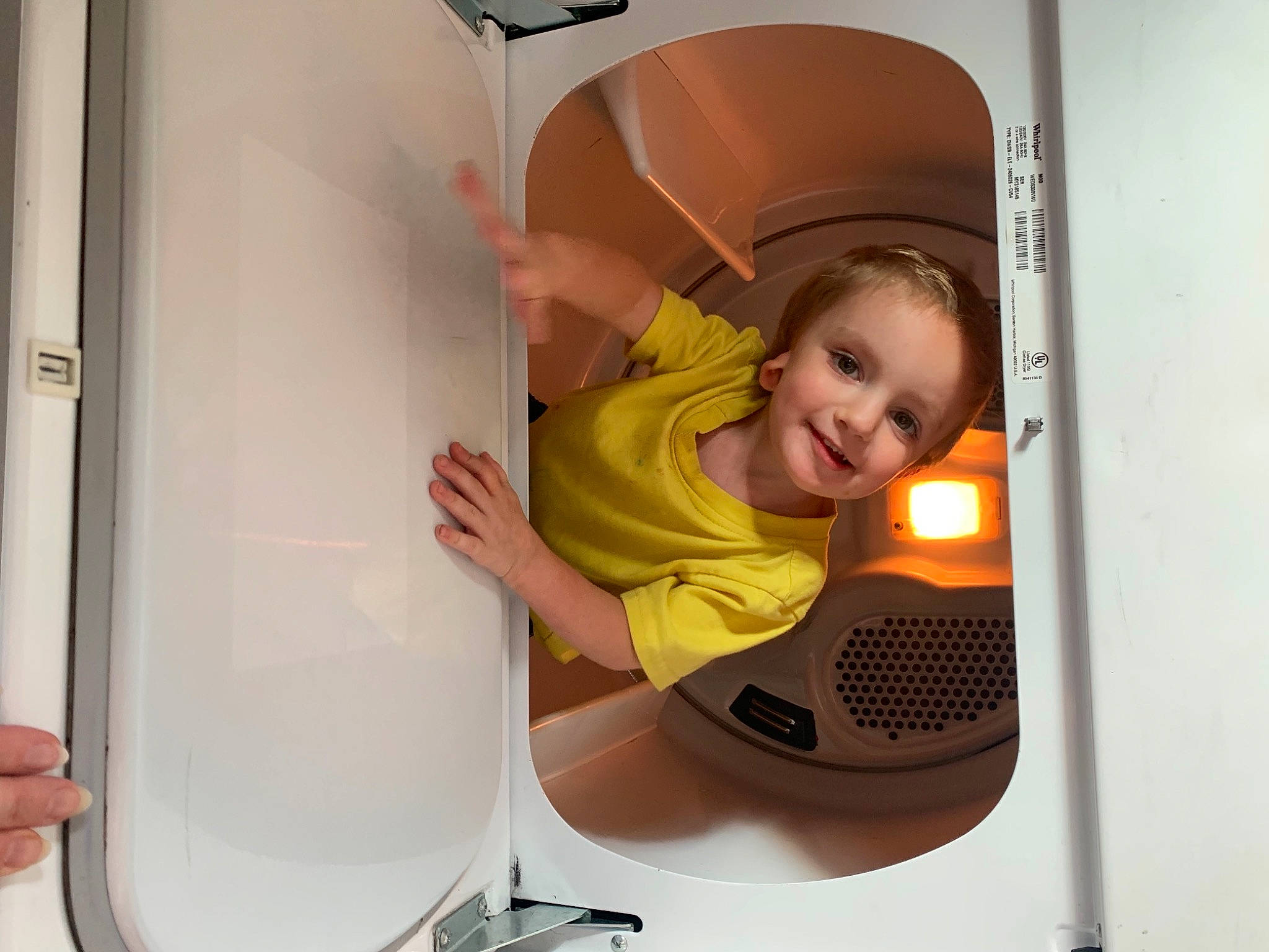 Justin is registered to the contest to win money with this photo: baby, baby_products, baby_safety, baby_toddler_clothing, cleanliness, comfort, hearing, joy, major_appliance, person, plastic, product, refrigerator, toddler